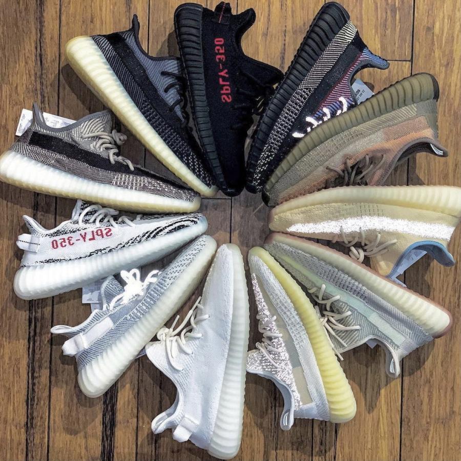 Various Yeezy trainers laid out in a circle