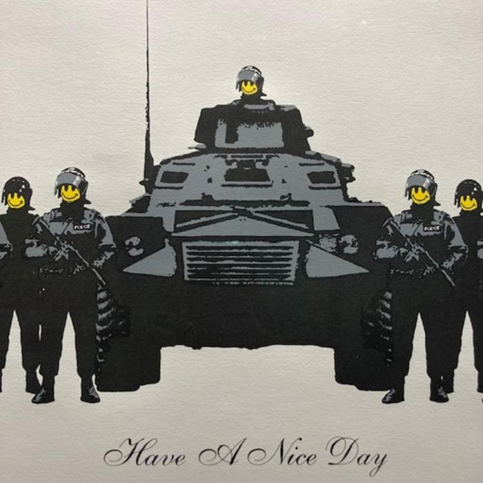 Banksy artwork featuring smiley face soldiers with a tank