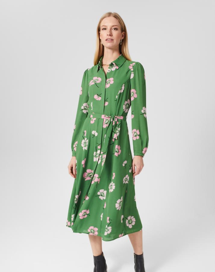 Blonde woman in green floral maxi dress